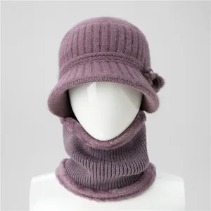 Detail of knit winter hat and scarf set with thick faux fur lining and pearl flower accent