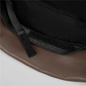 Detail of adjustable velcro strap and premium fabric lining inside a brown leather hat
