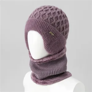 Detail of purple knit hat set with honeycomb pattern and soft faux fur lining