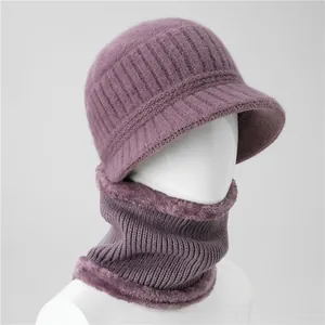 Detail view of purple knitted hat and neck gaiter set with thick faux fur lining for winter