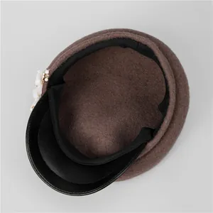 Brown wool newsboy hat for women with black leather brim and elegant pearl flower accent