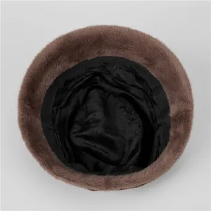 Close-up of brown faux fur bucket hat featuring a sleek black inner lining and reinforced rim