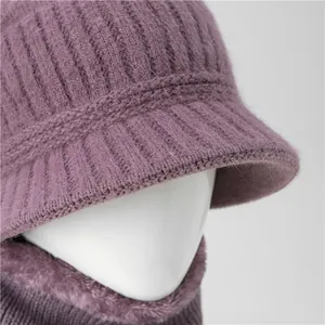 Detail view of purple knit winter hat and fleece neck warmer set with cable textures