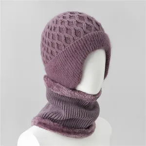 Close-up of purple knitted winter hat and scarf set with thick plush fleece lining