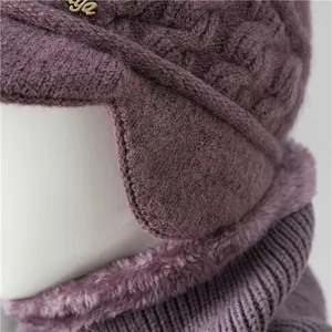 Purple winter knit beanie with ear flaps and thick faux fur lining for elderly women