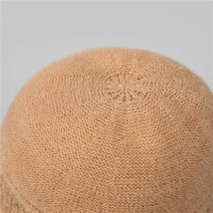 Winter knit bucket hat for elderly women featuring a warm star-pattern crown in camel color