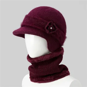 Detail of burgundy rabbit fur knit hat and scarf set with floral rhinestone accents