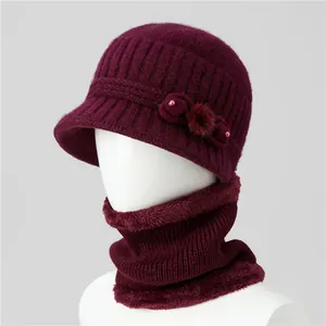 Detail view of the warm burgundy knitted hat and neck scarf set with fleece lining