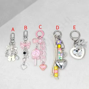 Five assorted Y2K style acrylic phone charms with pearls, hearts and letter beads