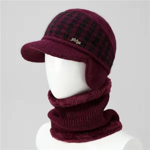 Close-up of winter knit hat with warm fleece lining and matching scarf set in burgundy