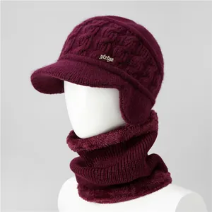 Detail of burgundy winter knit hat and scarf set with thick fleece lining for warmth