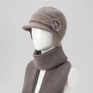 Detail of grey-brown knit hat and scarf set with floral rhinestone embellishment
