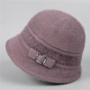 Detail of purple knit bucket hat showing warm velvet texture and silver metal buckle