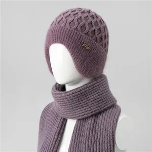 Detail of greyish purple winter knit hat and scarf set with fleece lining for elderly women