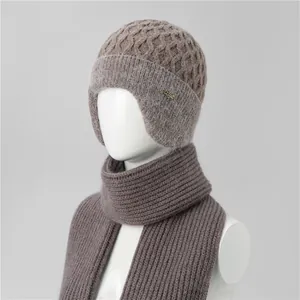 Detailed knit texture and metal logo on winter ear-protection hat and scarf set
