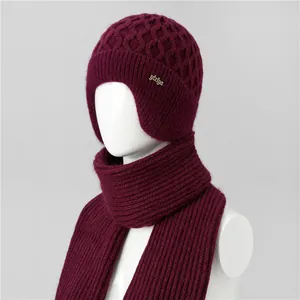 Detailed view of wine red honeycomb knit hat and scarf set with ear protection design