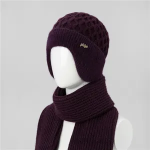 Detail of dark purple knit hat and scarf set with fleece lining for elderly women