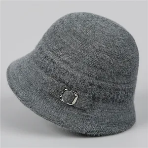 Detailed close-up of dark grey knitted cloche hat with fuzzy texture and silver buckle