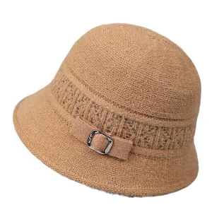 Elegant women's warm knitted cloche hat in camel with decorative hollow patterns and buckle