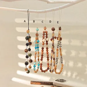Handmade wooden beaded wrist straps for cell phones and bags in five creative styles