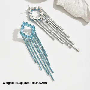 Exaggerated long tassel drop earrings with light blue rhinestones in silver finish