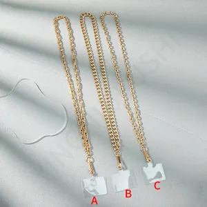 Three gold metal chain phone lanyards with lobster clasps and abstract pattern cards