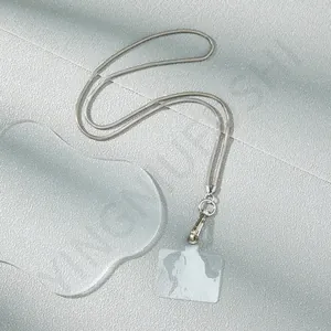 Detail of silver snake chain mobile strap with lobster clasp and transparent tab