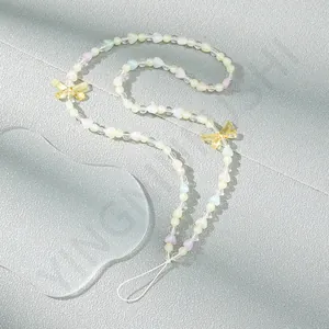 Pastel beaded phone strap with colorful heart beads and butterfly accents on gray background