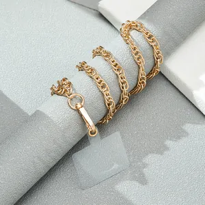 Detail of gold metal chain phone lanyard with transparent TPU pad and spring clip