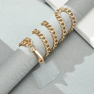 Detail of golden metal phone chain with lobster clasp and clear connection pad