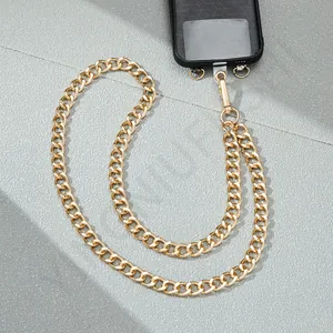Detail of chunky gold metal link chain for phone cases with spring ring clasps
