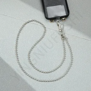 Detailed view of silver metal bead phone chain with secure lobster clasp and connector