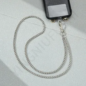 Macro shot of a silver box chain long phone lanyard with a metallic luster finish