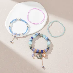 Bohemian multi-layer beaded bracelet set with moon, star charms and shell pendants