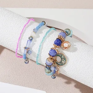 Bohemian multi-layer beaded bracelet set with seashell and moon pendants in pastel colors