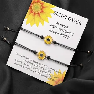 Close-up of handmade woven sunflower bracelets with alloy charms on gift card