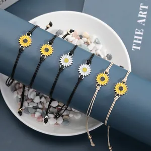 Close-up of six woven sunflower bracelets with adjustable cords on a display stand