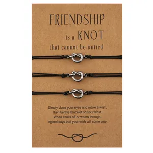 Set di 3 braccialetti con nodo in acciaio inossidabile su carte dell'amicizia nere