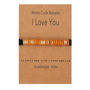Handmade Morse code bracelet with orange beads on I Love You sentiment card