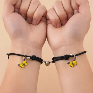 Verstellbare magnetische Herz-Pärchen-Armbänder mit gelbem Schmetterling und schwarzem Seil