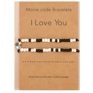 Minimalist Morse code couple bracelets with heart-shaped magnetic clasp on kraft card