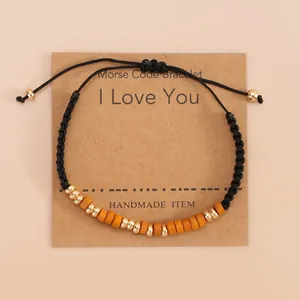 Morse code bracelet with wooden beads and I Love You message on cardstock