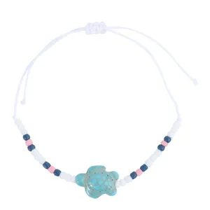 Detail of adjustable braided cord with turquoise turtle charm and colorful seed beads