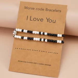 Morse code couple bracelets with heart magnetic clasp on I Love You display card