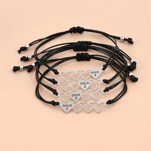 Set of 4 friendship bracelets with heart charms and adjustable black woven cord