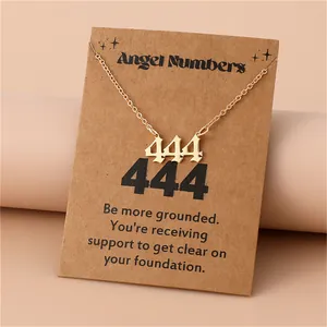 Detail of gold angel number 444 necklace with kraft card display and meaning message