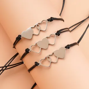 Three-piece interlocking heart charm bracelets with adjustable black woven wax cords