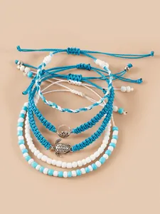 Détails de bracelets de perles bleu et blanc avec breloques tortue et vague en argent