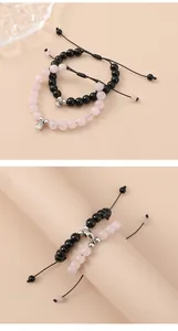 Detail view of pink and black beaded magnetic bracelets with adjustable woven cords