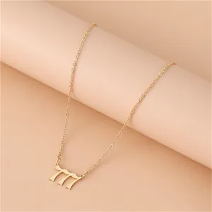 Macro detail of gold 777 angel number pendant with gothic style and fine cross chain